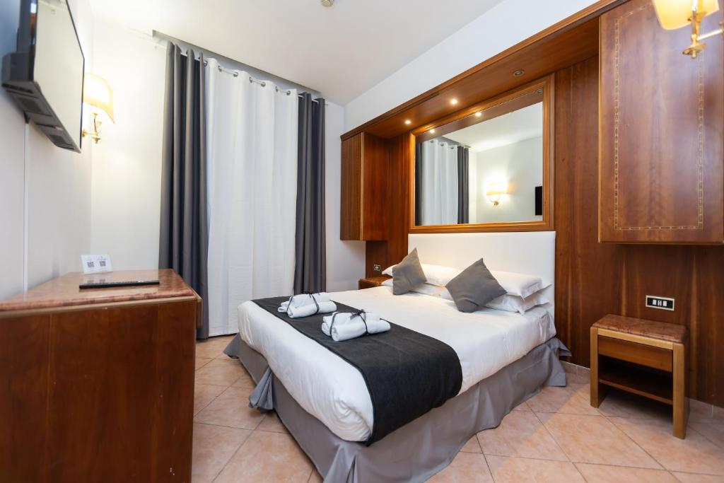 Postel nebo postele na pokoji v ubytování Hotel Max