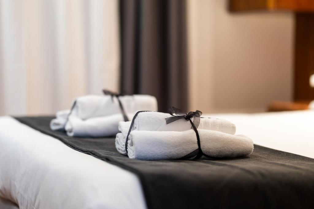 Postel nebo postele na pokoji v ubytování Hotel Max