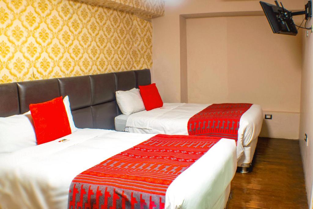 Letto o letti in una camera di Hotel Royal Qosqo