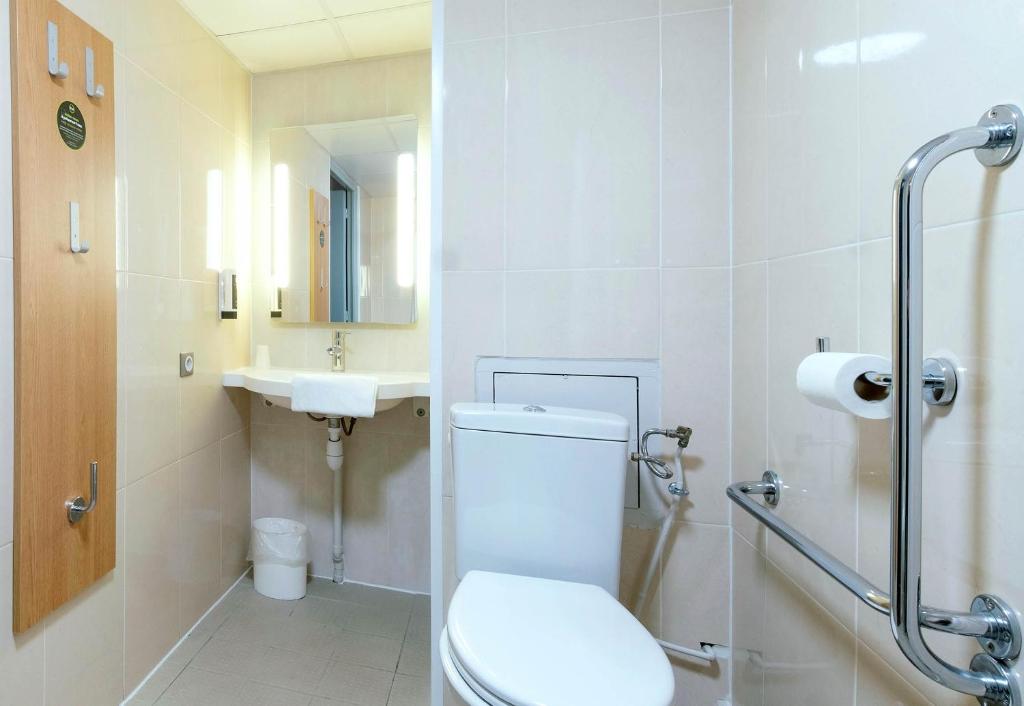 a bathroom with a toilet and a sink at B&B HOTEL La Rochelle Angoulins in Angoulins-sur-Mer