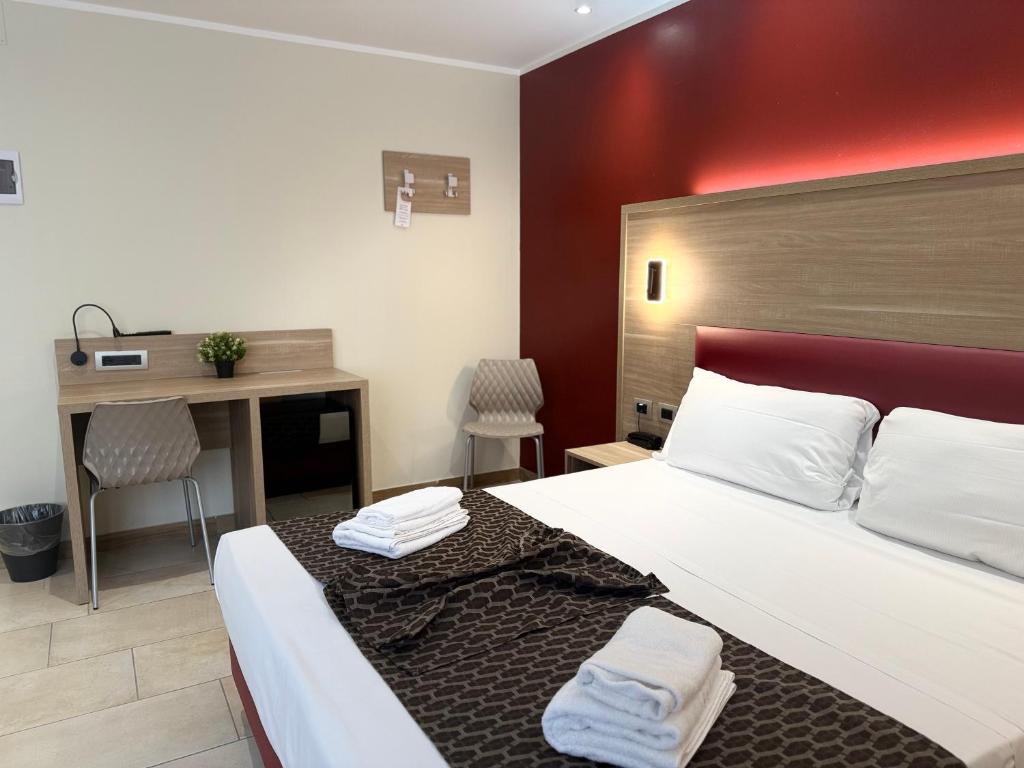 Postel nebo postele na pokoji v ubytování Hotel Giacosa