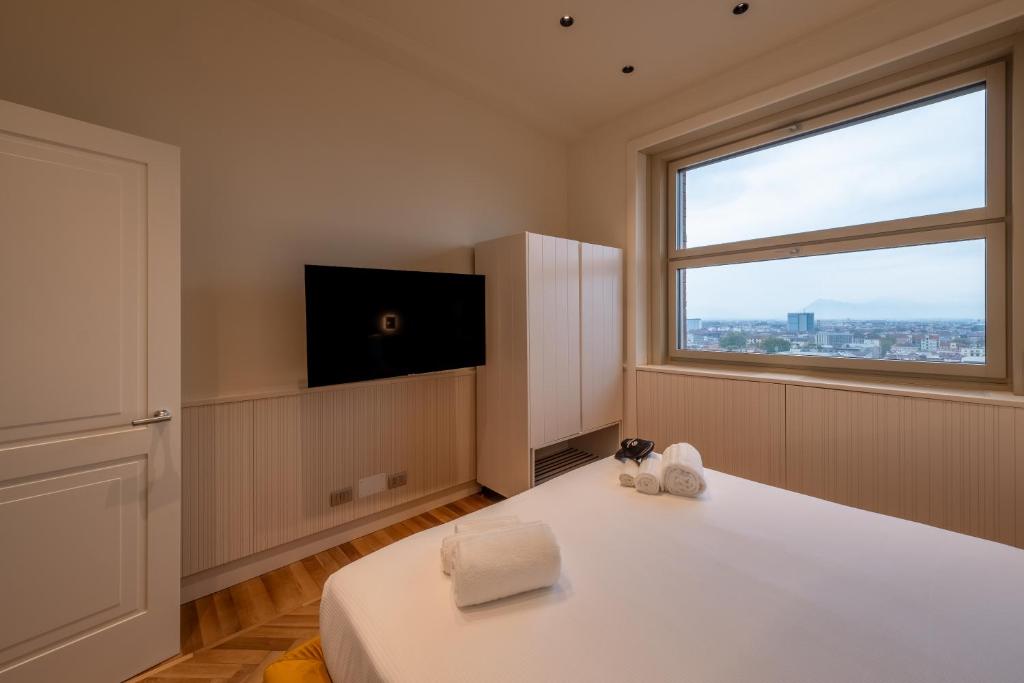 Posteľ alebo postele v izbe v ubytovaní Prestige Apartments Torino