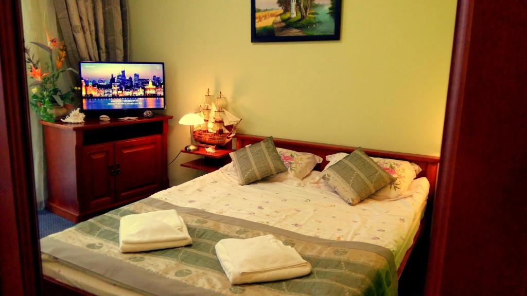 Postel nebo postele na pokoji v ubytování Hotel Spinaker