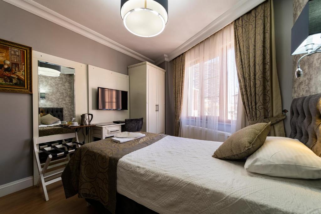 Postel nebo postele na pokoji v ubytování Levent Hotel Istanbul