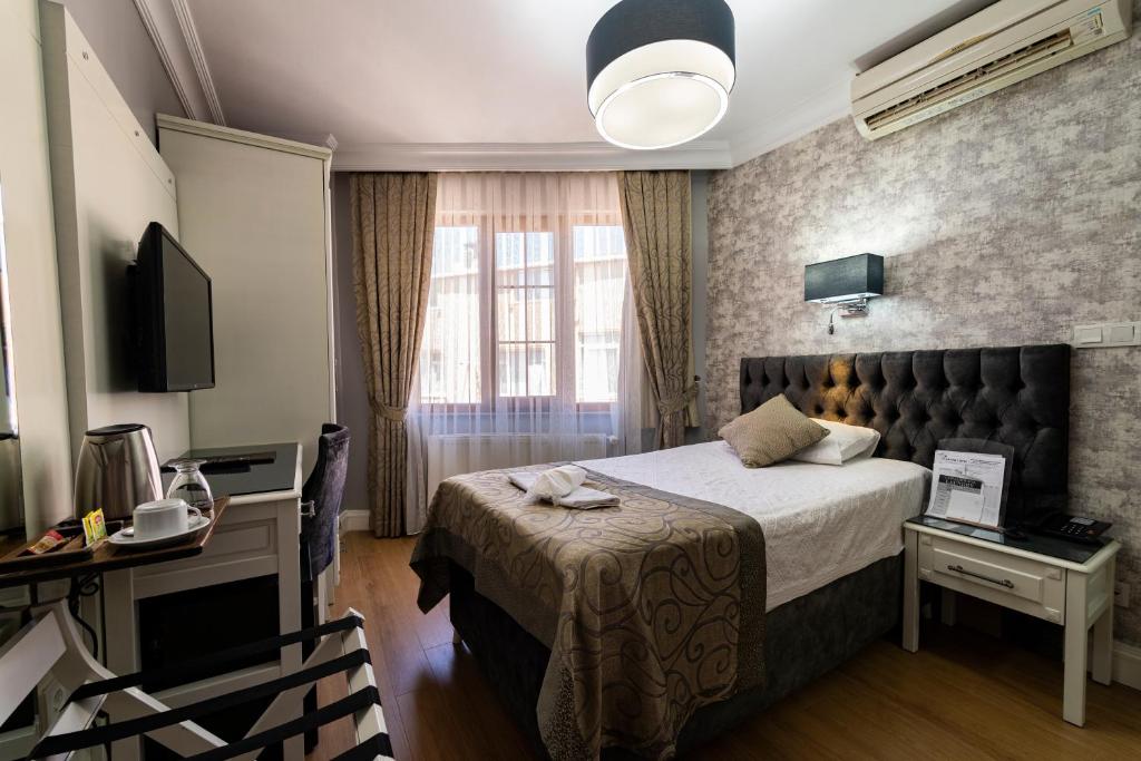 Postel nebo postele na pokoji v ubytování Levent Hotel Istanbul