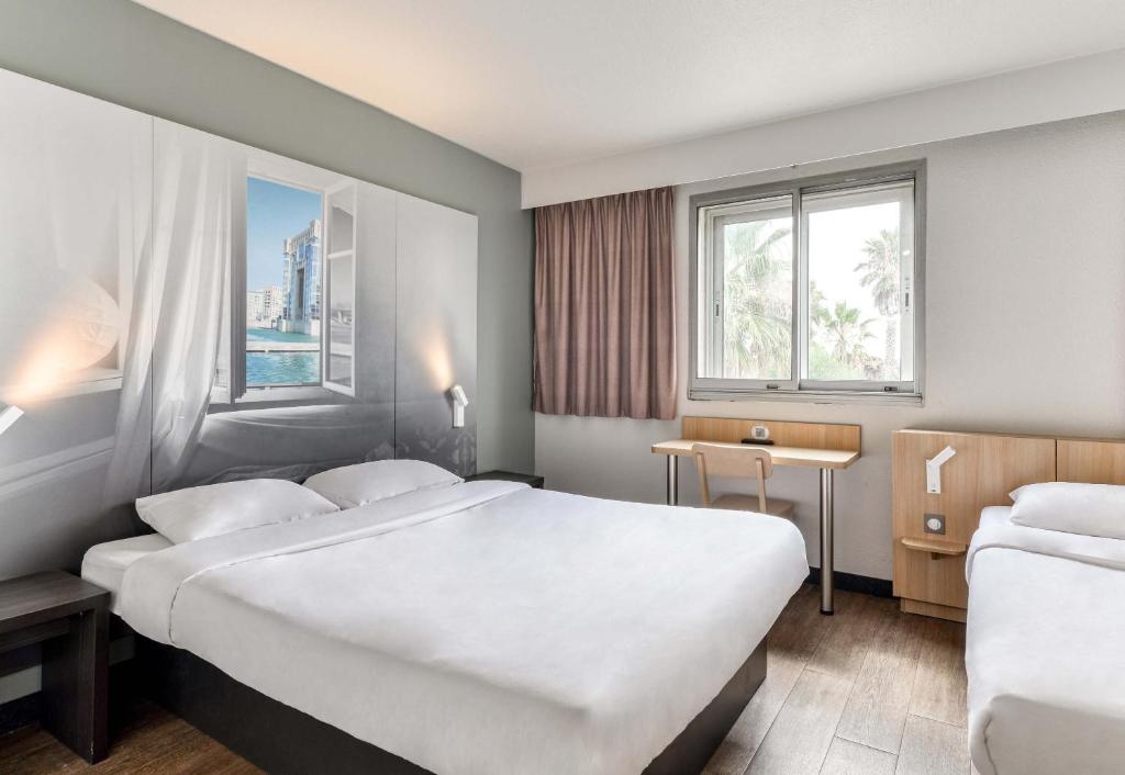 Postel nebo postele na pokoji v ubytování B&B HOTEL Montpellier Vendargues
