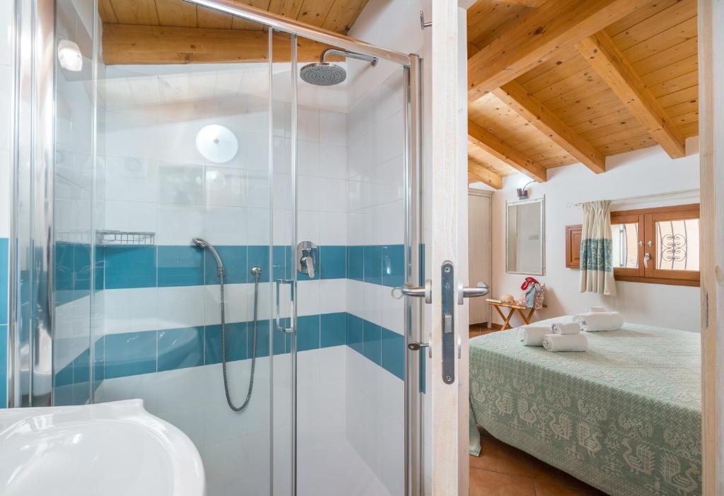 Postel nebo postele na pokoji v ubytování Bosa Queen House