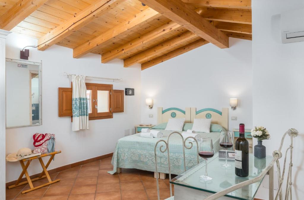 Postel nebo postele na pokoji v ubytování Bosa Queen House
