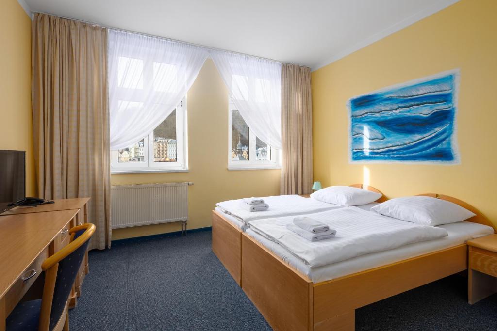 Кровать или кровати в номере Wellness Hotel Jean De Carro