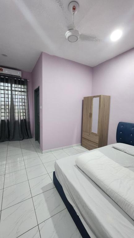 Postel nebo postele na pokoji v ubytování Kelambu Beach Villa