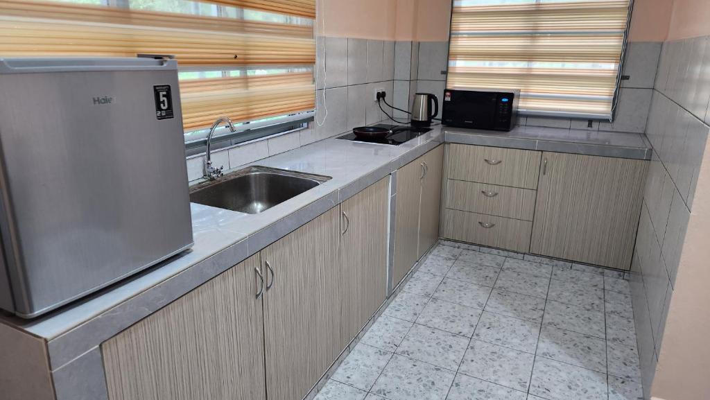 Kuchyň nebo kuchyňský kout v ubytování Kelambu Beach Villa