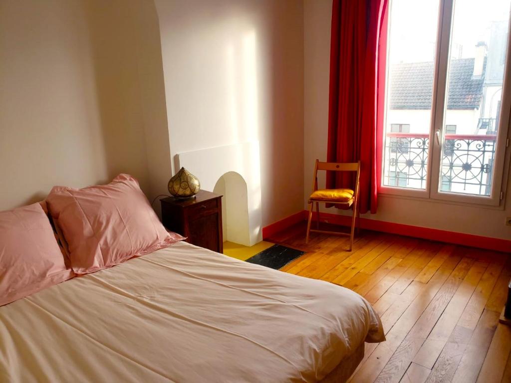 Postel nebo postele na pokoji v ubytování Un petit coin de soleil chez l'habitant