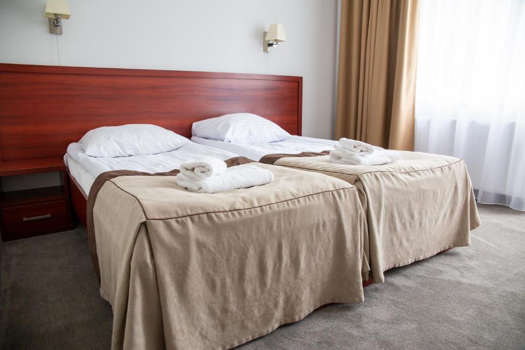 Posteľ alebo postele v izbe v ubytovaní POŁONINY Resort