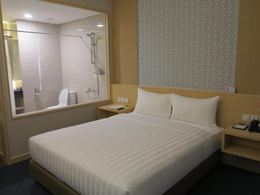 Postel nebo postele na pokoji v ubytování GTV Hotel