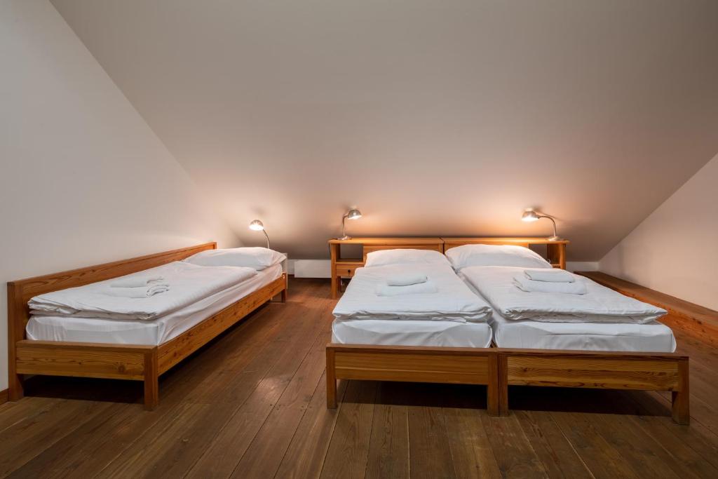 Postel nebo postele na pokoji v ubytování Zámecký Hotel Litomyšl