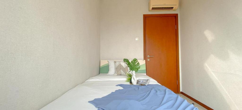 Ένα ή περισσότερα κρεβάτια σε δωμάτιο στο Stunning Comfy Spacious Apartment at the Heart of Jakarta