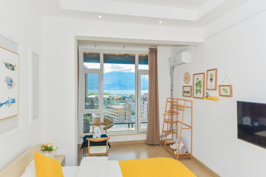 TV a/nebo společenská místnost v ubytování Dali Listening Seaview Villa大理听城海景别墅