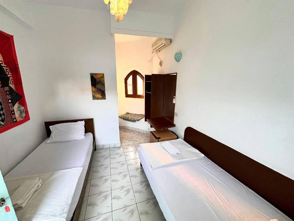Postel nebo postele na pokoji v ubytování Amanda beach hotel