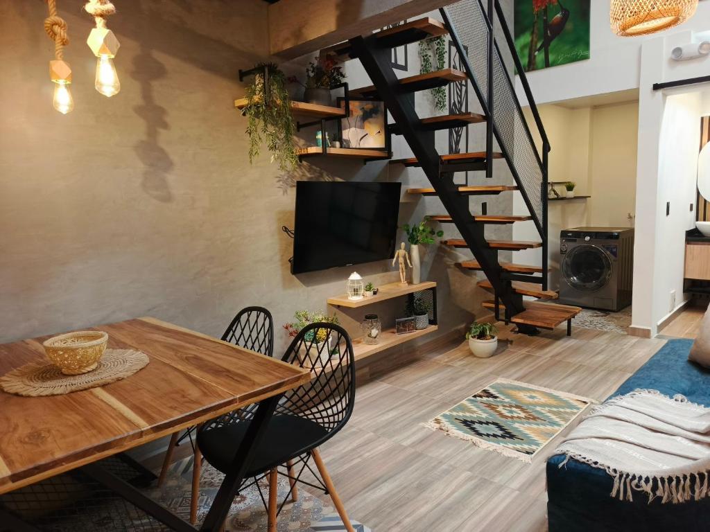 TV a/nebo společenská místnost v ubytování Hope Aparta Lofts
