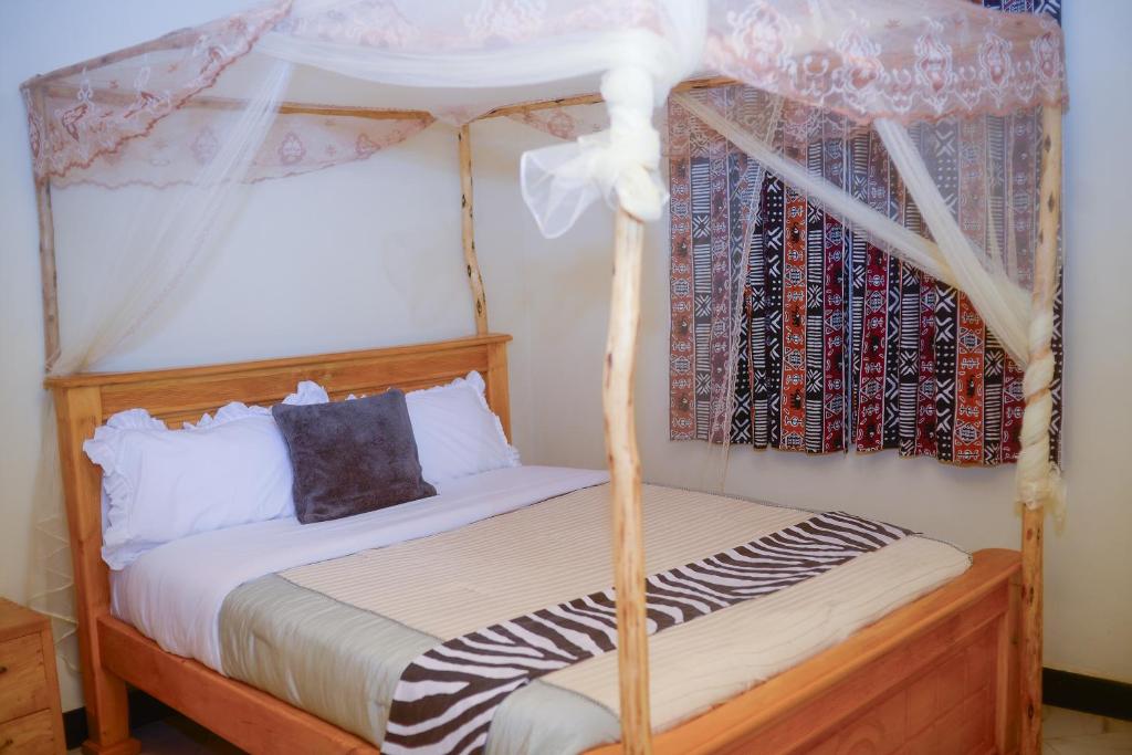 Postel nebo postele na pokoji v ubytování Chabrees Residence