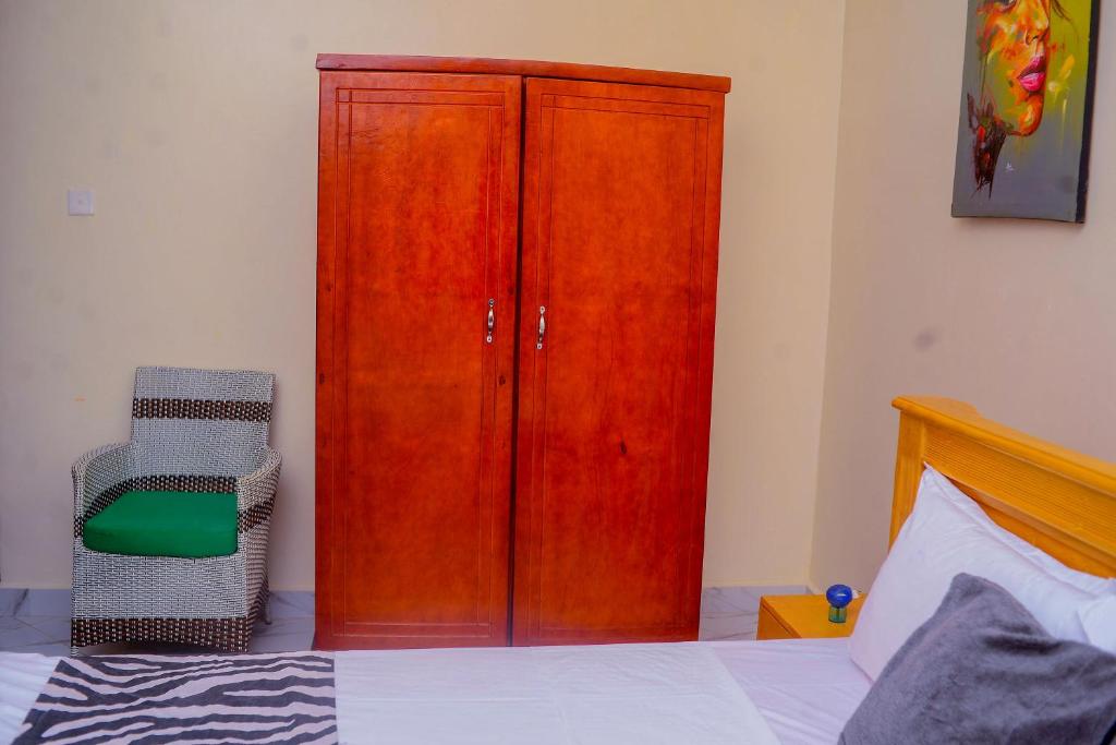 Postel nebo postele na pokoji v ubytování Chabrees Residence
