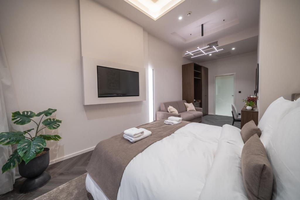 Postel nebo postele na pokoji v ubytování Damas Suites Budapest