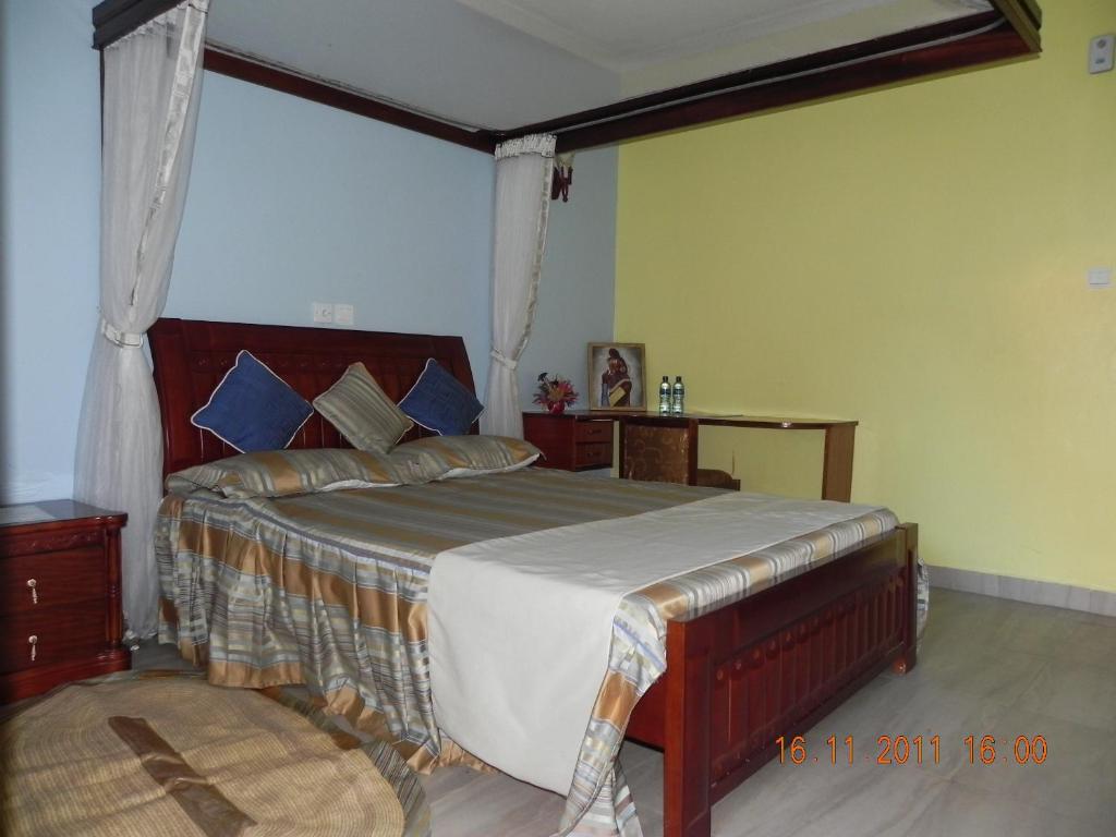 Postel nebo postele na pokoji v ubytování Lambada Holiday Resort Mombasa
