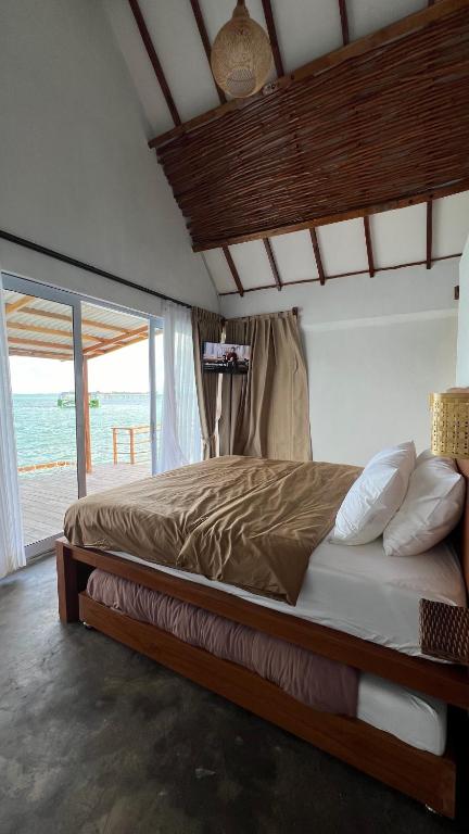 Postel nebo postele na pokoji v ubytování Sadi Beach House