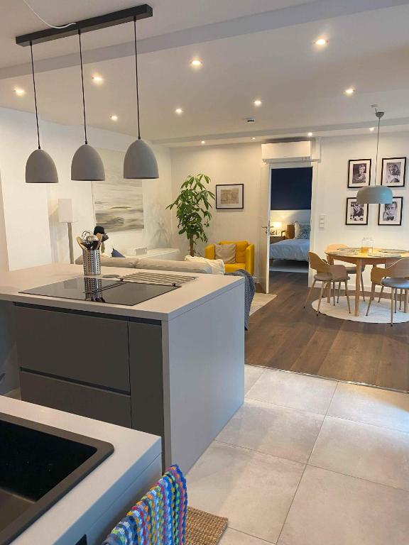 a kitchen and living room with a couch and a table at CityLoft Andernach in Andernach
