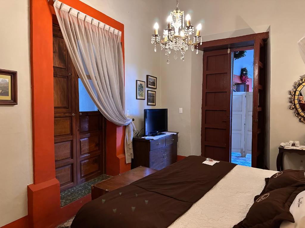 Postel nebo postele na pokoji v ubytování Santa Elena Hotel Boutique