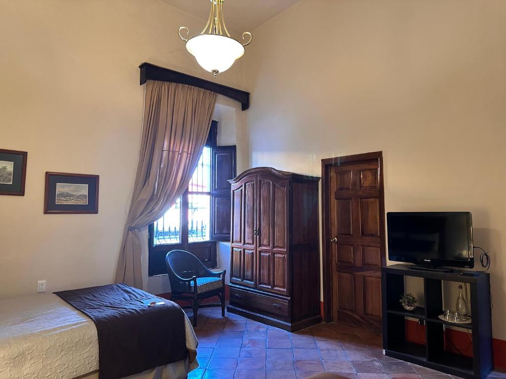 TV a/nebo společenská místnost v ubytování Santa Elena Hotel Boutique