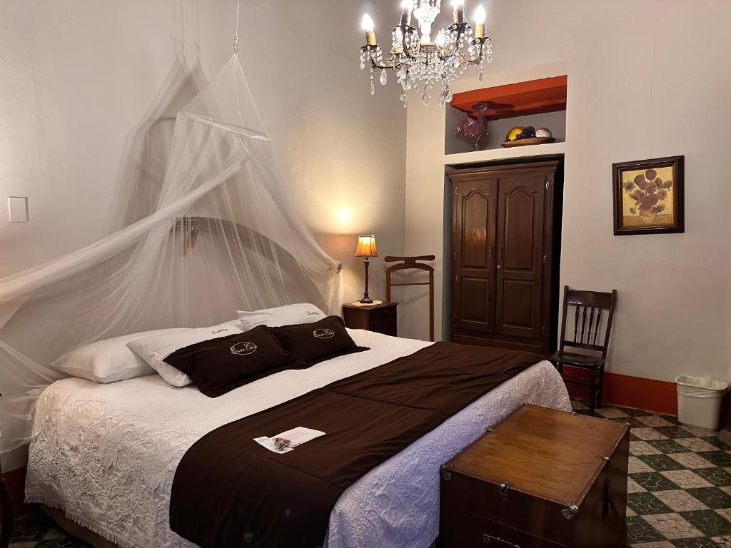 Postel nebo postele na pokoji v ubytování Santa Elena Hotel Boutique