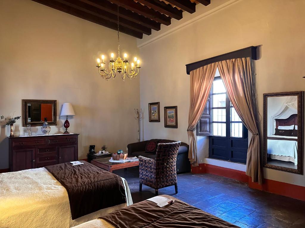 Postel nebo postele na pokoji v ubytování Santa Elena Hotel Boutique