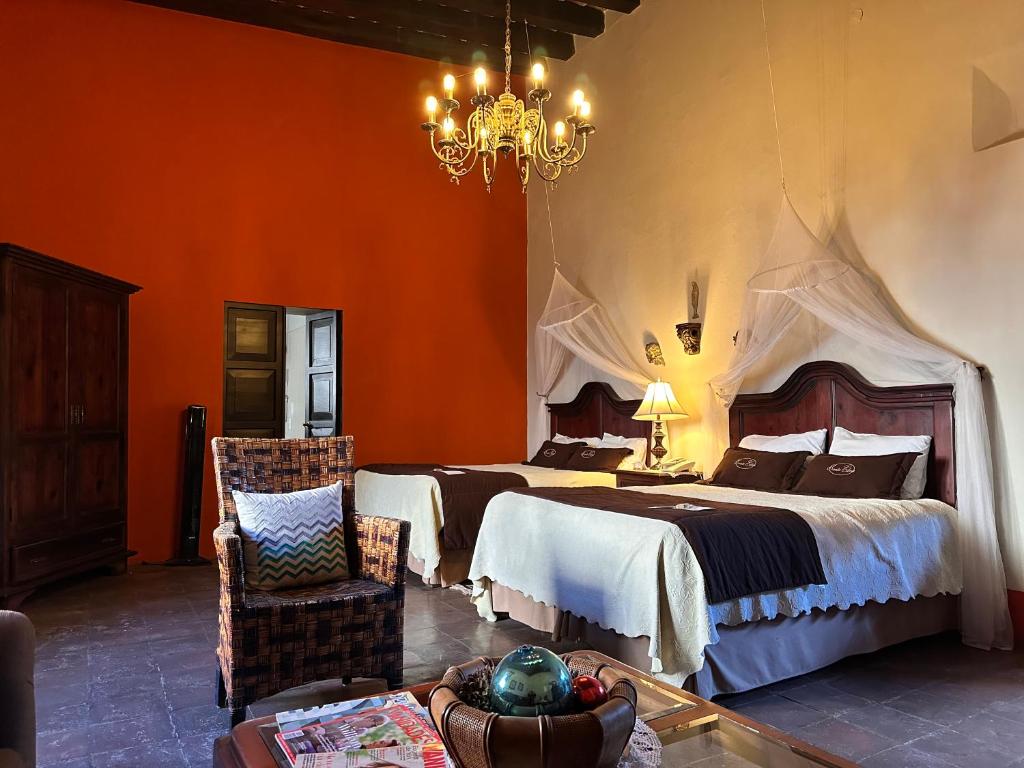 Postel nebo postele na pokoji v ubytování Santa Elena Hotel Boutique