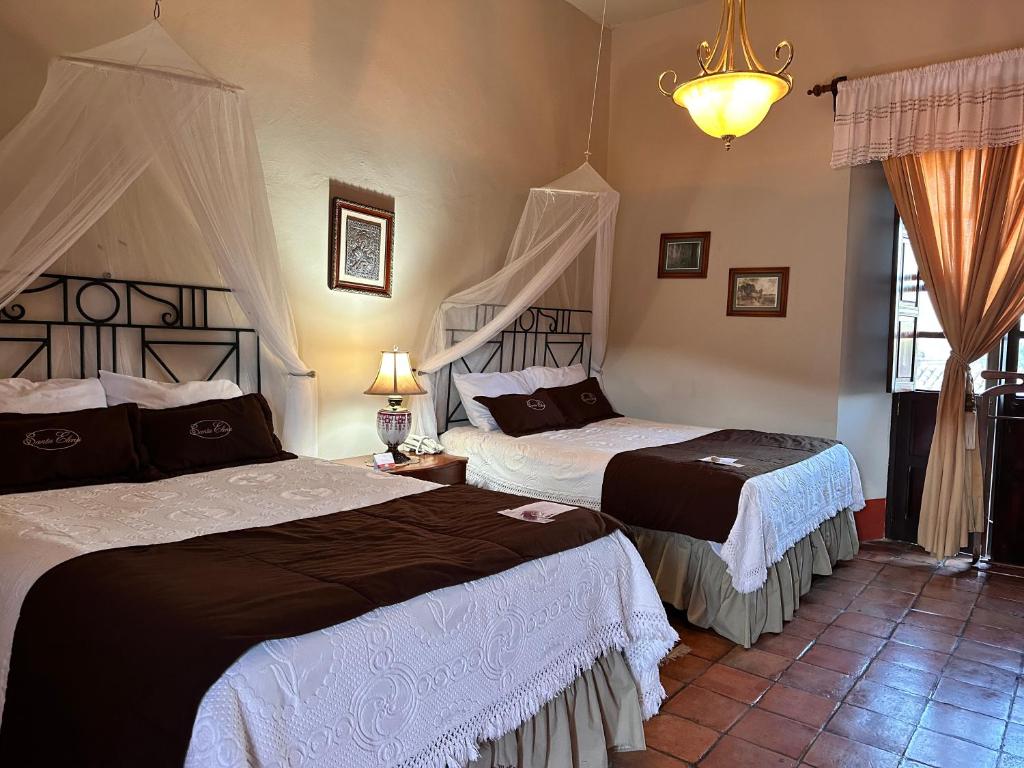 Postel nebo postele na pokoji v ubytování Santa Elena Hotel Boutique