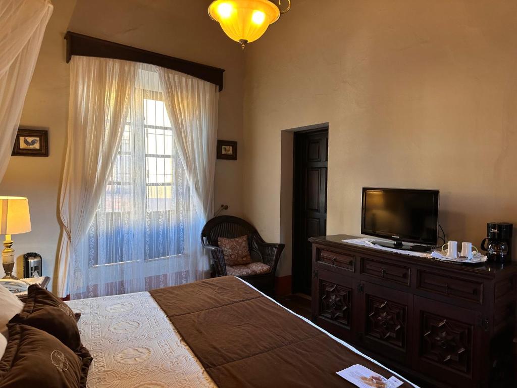 Postel nebo postele na pokoji v ubytování Santa Elena Hotel Boutique