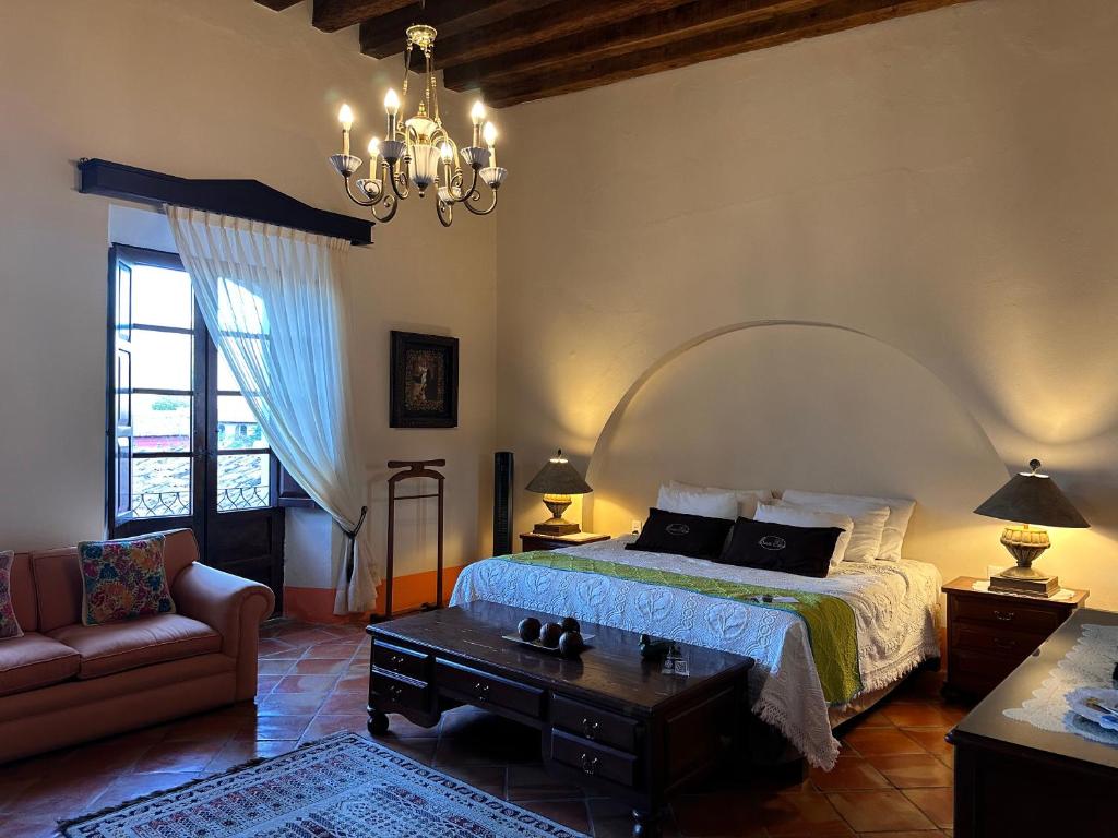 Postel nebo postele na pokoji v ubytování Santa Elena Hotel Boutique