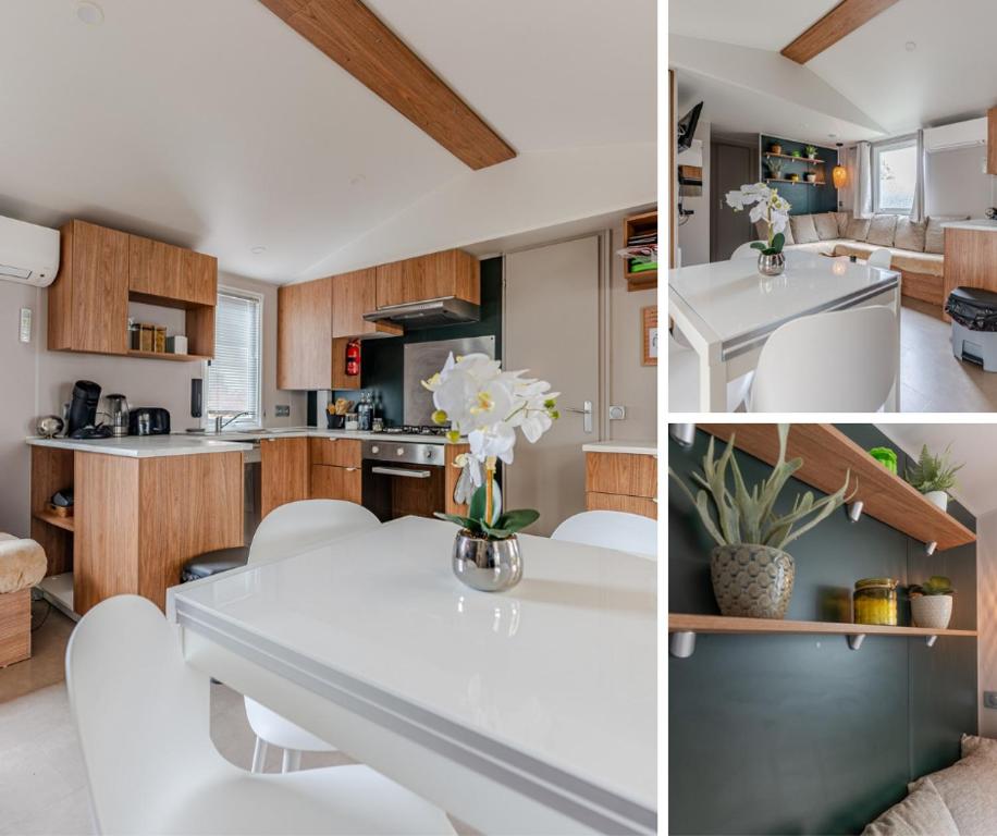 - une cuisine avec une table blanche et des chaises blanches dans l'établissement Havre de paix Gastes MH 704, à Gastes