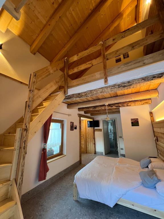 Postel nebo postele na pokoji v ubytování Locanda al Toal