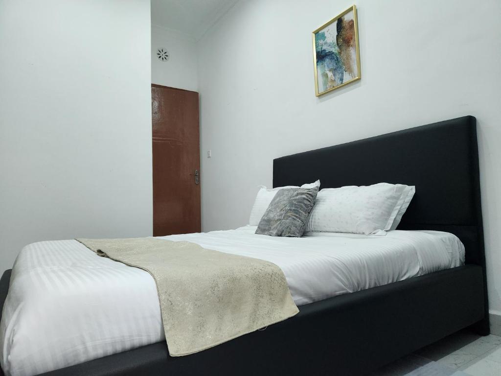 Postel nebo postele na pokoji v ubytování Elysian Homes Villa Naivasha