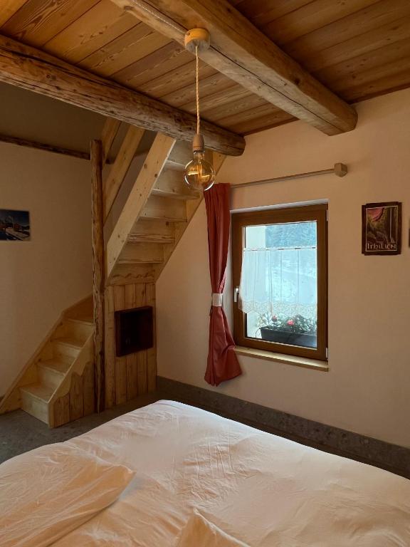 Postel nebo postele na pokoji v ubytování Locanda al Toal