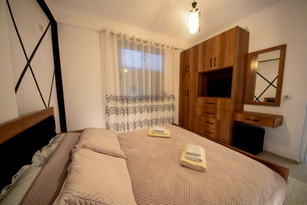 Postel nebo postele na pokoji v ubytování Aila Apartament