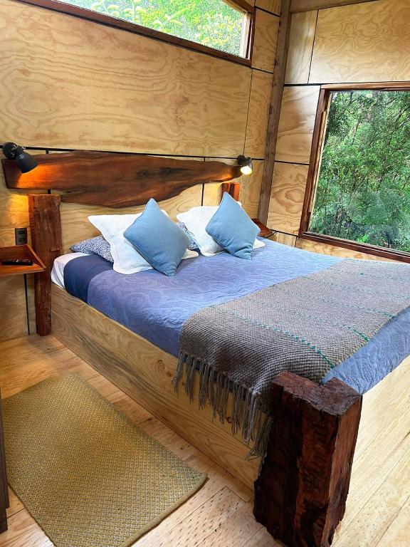 Postel nebo postele na pokoji v ubytování Cabañas Los Cantos del Chucao