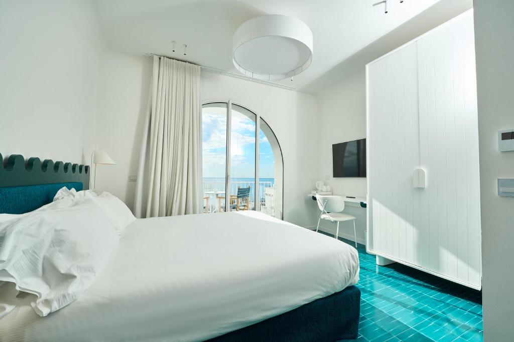 Postel nebo postele na pokoji v ubytování CALEA Boutique Hotel