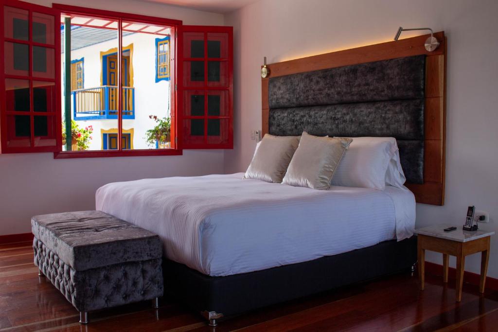 Una cama o camas en una habitación de Atardeceres del Cafe