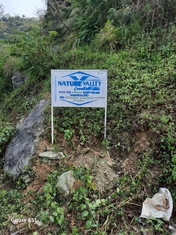 a sign on the side of a hill at Nature valley home stay in Marchula
