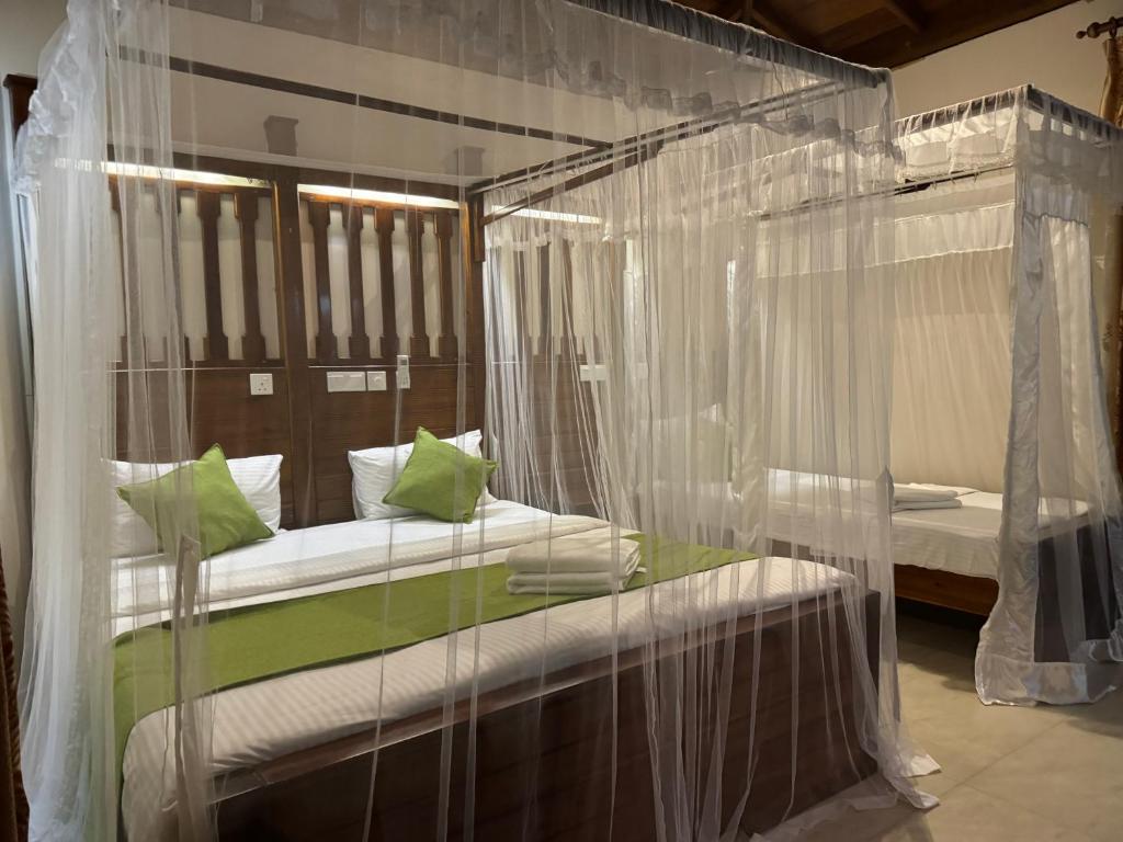 Postel nebo postele na pokoji v ubytování Brinkhouse Guesthouse , Unawatuna beach