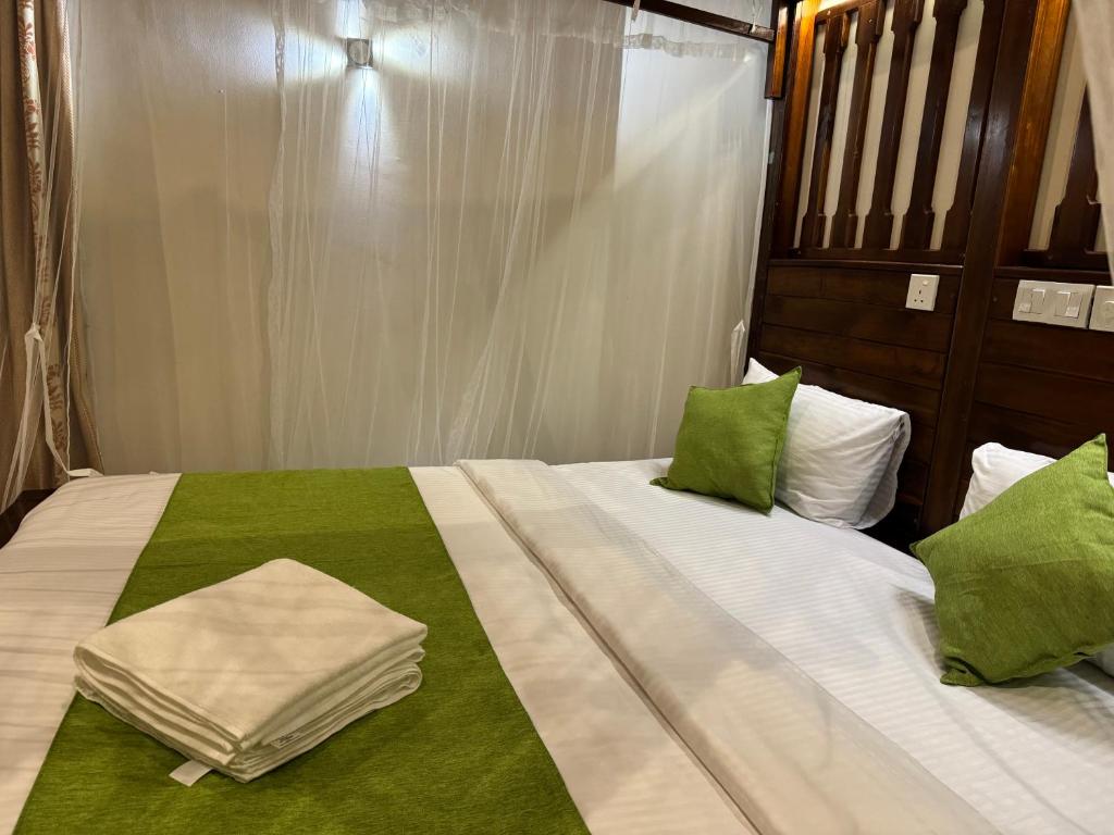 Postel nebo postele na pokoji v ubytování Brinkhouse Guesthouse , Unawatuna beach