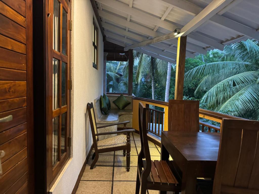 Balkón nebo terasa v ubytování Brinkhouse Guesthouse , Unawatuna beach