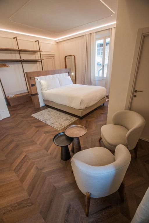 Postel nebo postele na pokoji v ubytování Palazzo Carletti